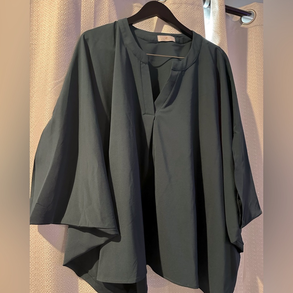 Never worn! Dark blue/green dress shirt with bubble sleeves. Size M/L